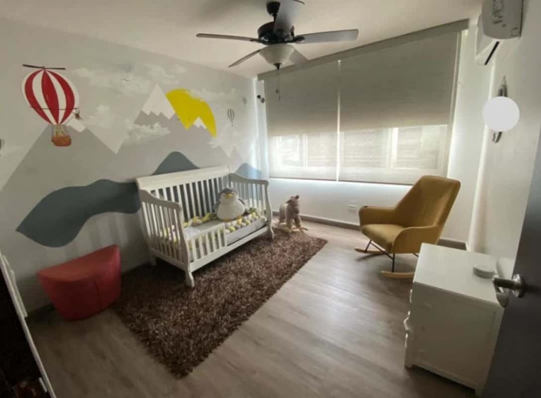Bright nursery children’s room with mountain mural in PH Obarrio Central Panama