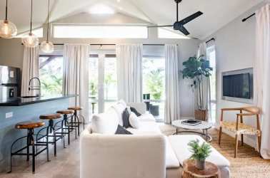 Exterior of beach villa with covered patio, wooden furniture, sliding glass doors Blue Venao Playa Venao Panama