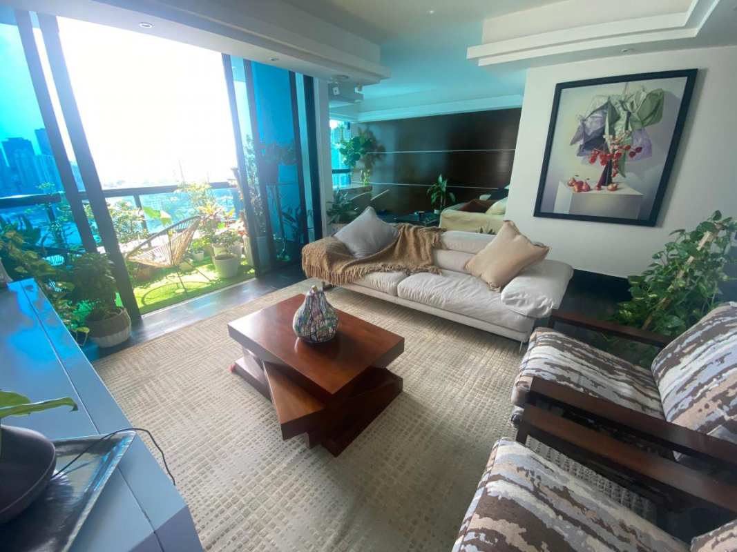 Modern living room with large windows, balcony garden, city views PH Pacific Bay Panama