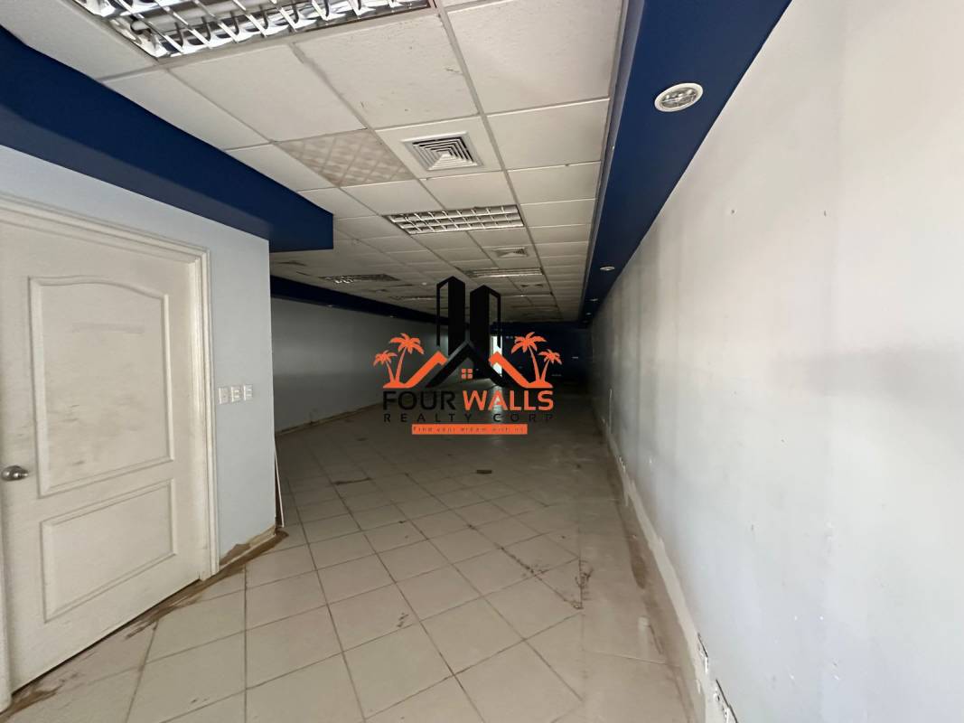 Spacious corridor with blue accents and fluorescent lighting commercial property Albrook Panama