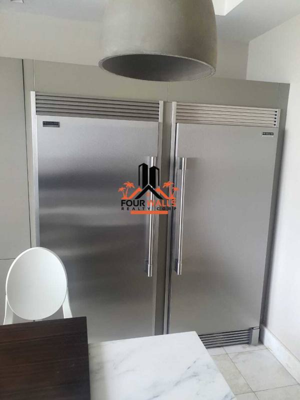 Open living dining area with ocean views modern fixtures in PH The Residence Punta Pacífica