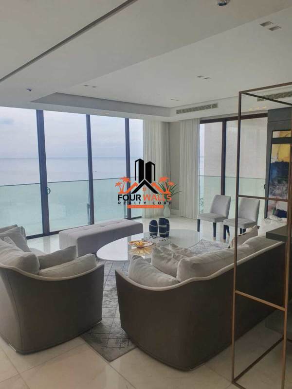 Elegant living area with ocean view balcony large windows in PH The Residence Punta Pacífica Panama