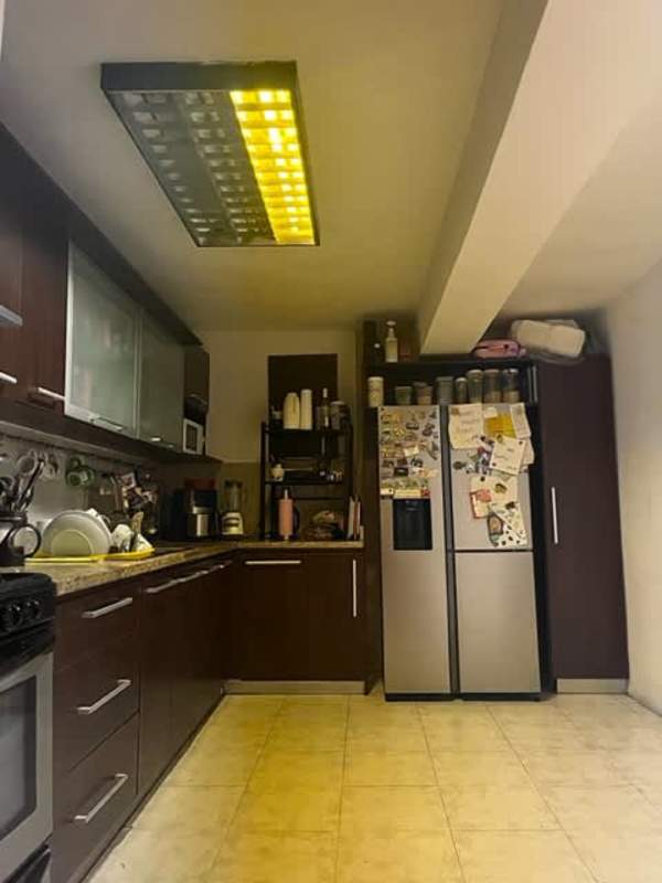 Utility laundry space with washing machine hookup, tiled steps inside Limajo house Panama