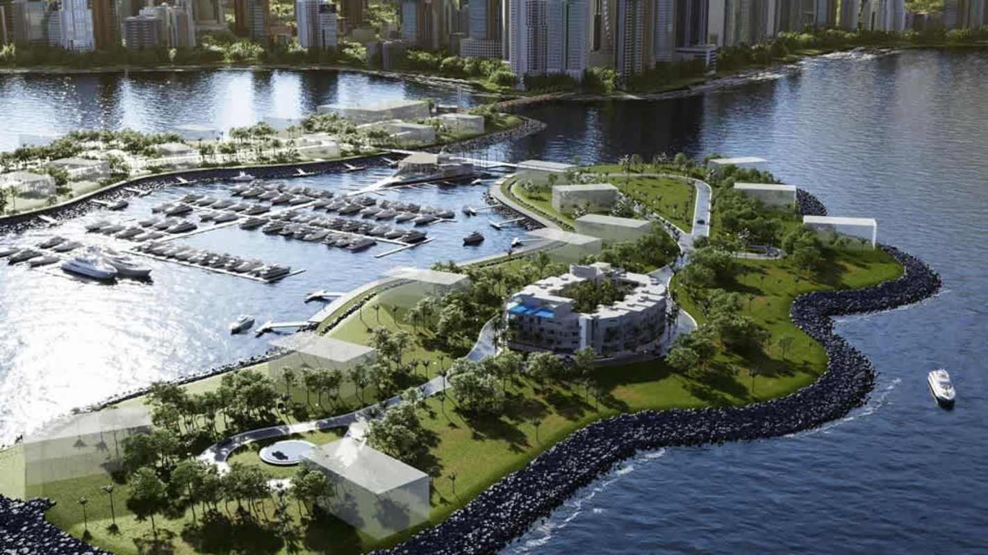 Modern residential condo building facade with green balconies in Ocean Reef Islands Panama City