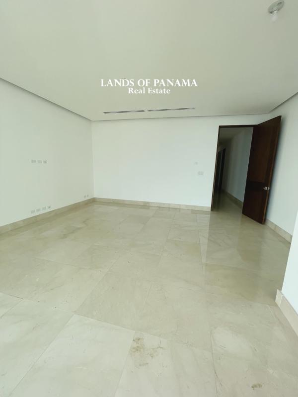 Elegant spacious living room with marble flooring, large glass windows and sea view in Costa del Este Panama City