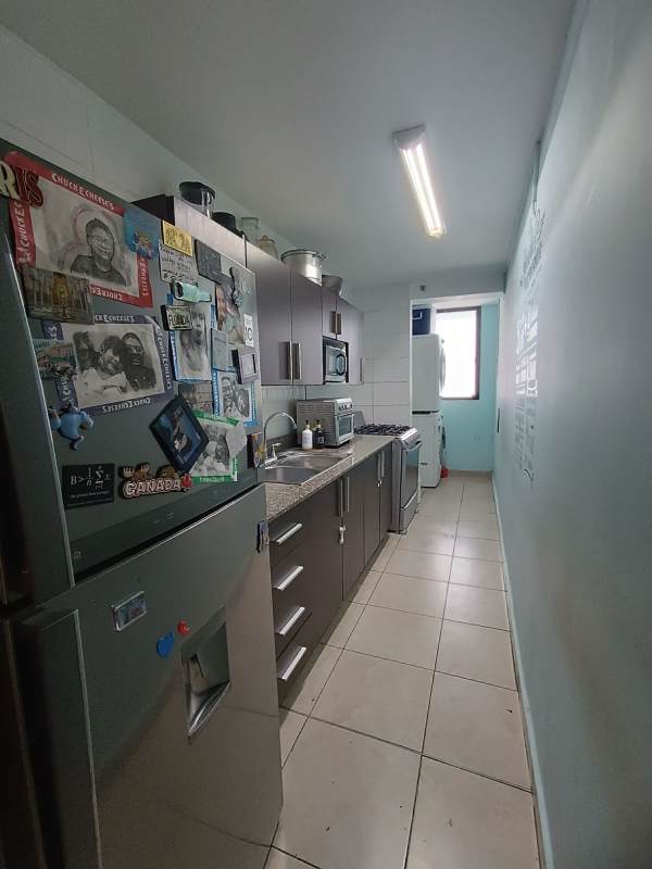 Galley kitchen granite countertop, refrigerator, stove PH Vista Verde Panama