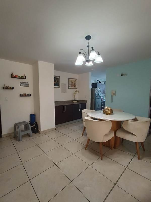 Contemporary dining area with round table and accent wall PH Vista Verde Panama