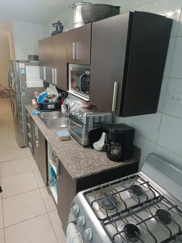 Contemporary kitchen granite countertops and dark wood cabinets Vista Verde Panama