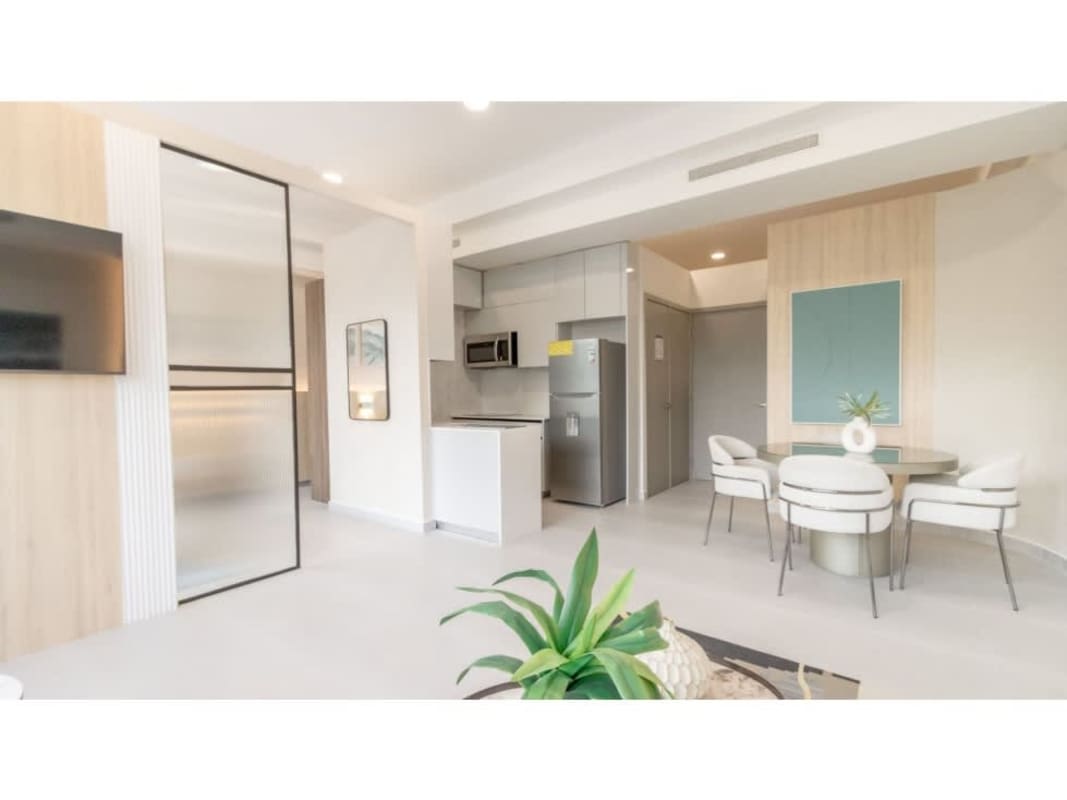 Modern bedroom with panoramic ocean and skyline views in PH Seaside Avenida Balboa Panama City