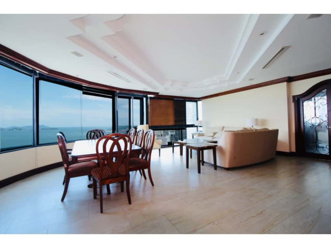 Spacious open living dining area with panoramic windows and ocean views in PH Coastal Tower Punta Paitilla