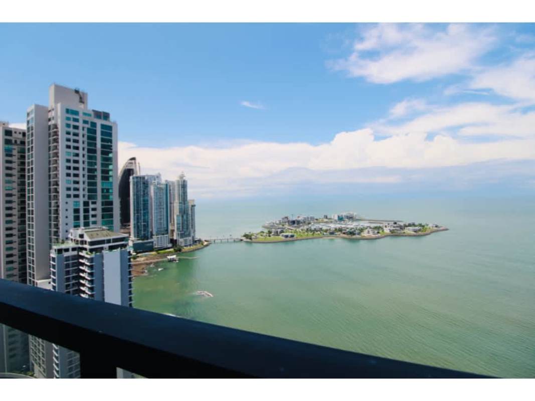 Oceanfront city skyline view from high-rise balcony with glass railing at PH Coastal Tower Punta Paitilla Panama