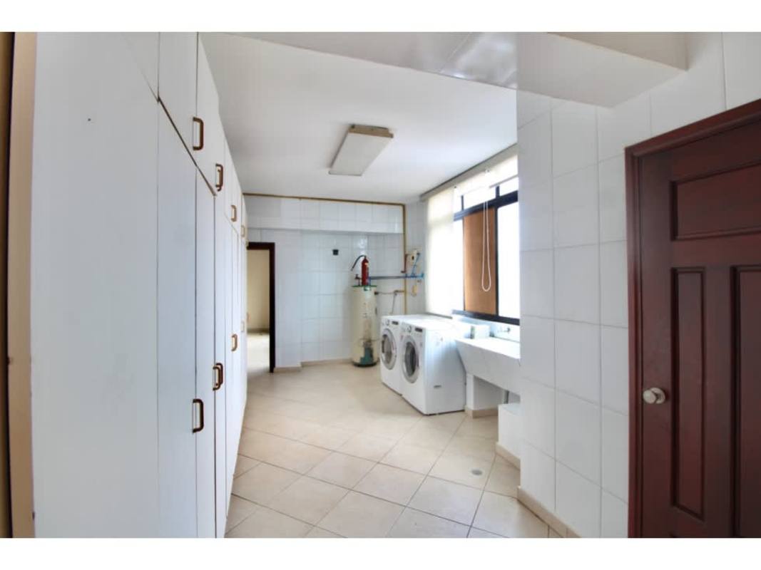 Spacious laundry area with washer dryer storage cabinets and natural light in PH Coastal Tower Punta Paitilla Panama