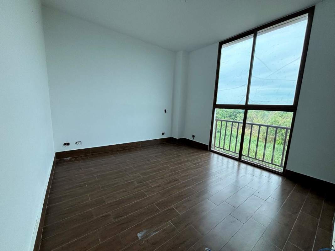 Large window bedroom overlooking greenery PH Costamare Costa Sur Panama