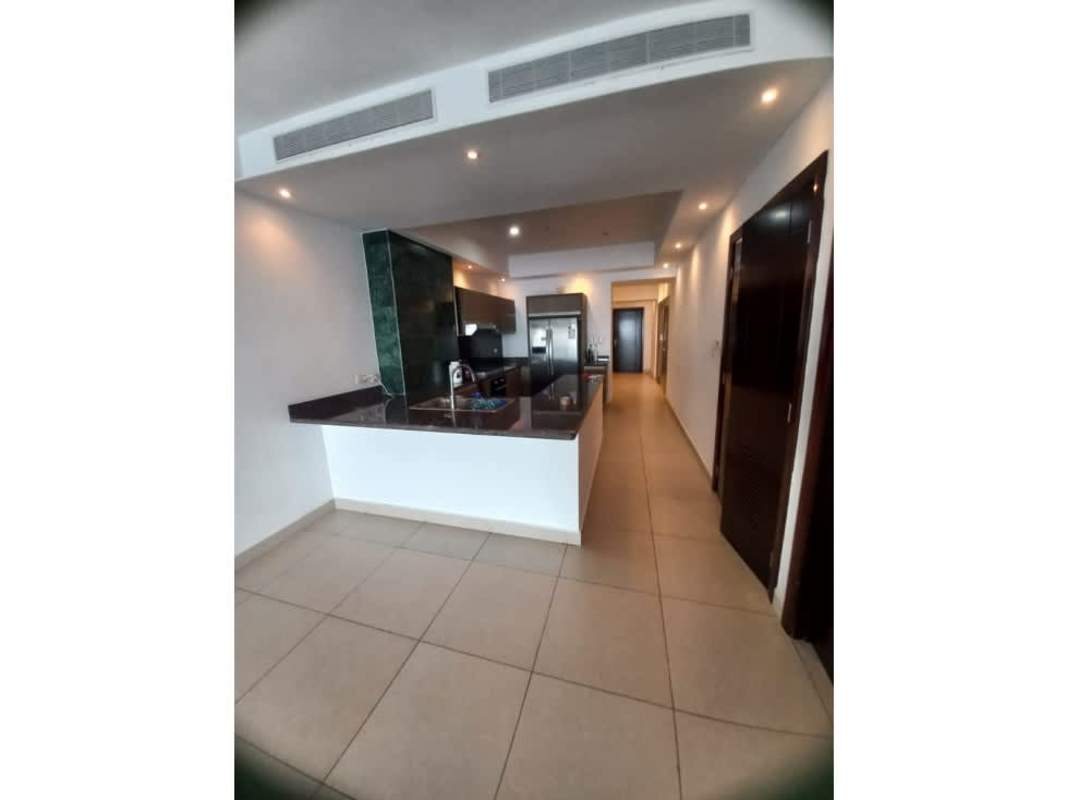 Stylish kitchen with an island counter, appliances, and modern cabinetry PH Rivage Tower Panama City