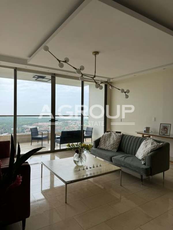 Contemporary living room with large windows, balcony access, panoramic golf view PH Greenview Santa María Panama