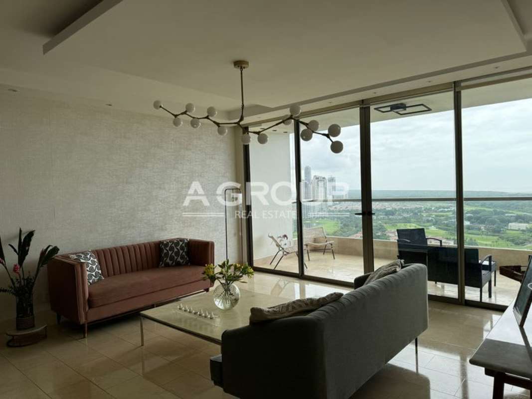 Modern living room with balcony, floor-to-ceiling windows, city and golf views in PH Greenview Santa María Panama