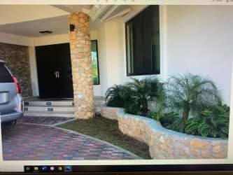 Balcony overlooking tropical gardens and ocean from luxury beach villa Coronado Panama