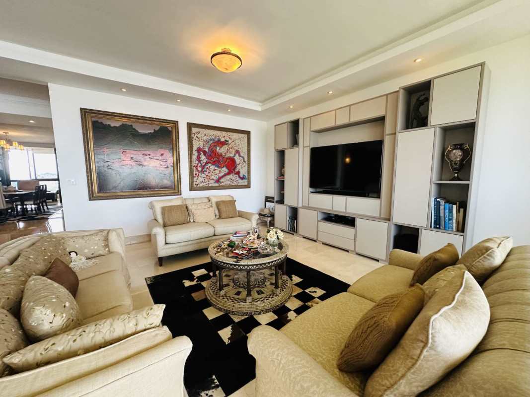 Modern kitchen with wood cabinets, granite countertops, stainless steel appliances in PH Panama Bay Tower Costa del Este Panama