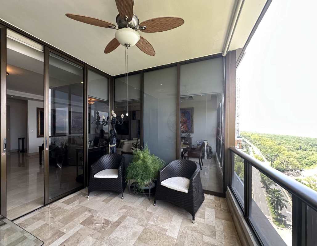 Balcony with seating area and views of ocean and Panama skyline PH Panama Bay Tower Costa del Este Panama