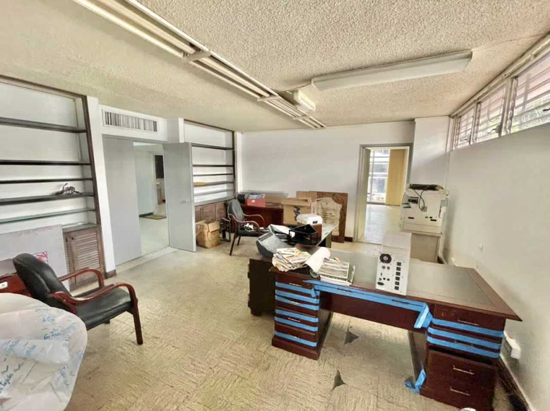 Mezzanine level office space with glass walls and natural light in PH Virrey