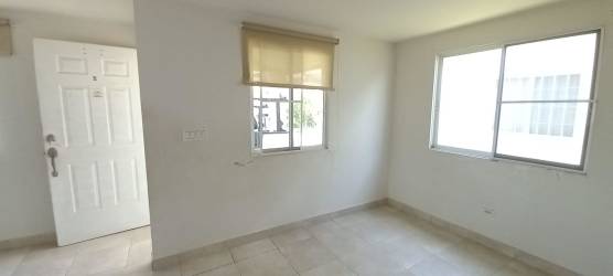 Spacious unfurnished living dining area large windows tiles in PH Las Olas Playa Dorada Panama