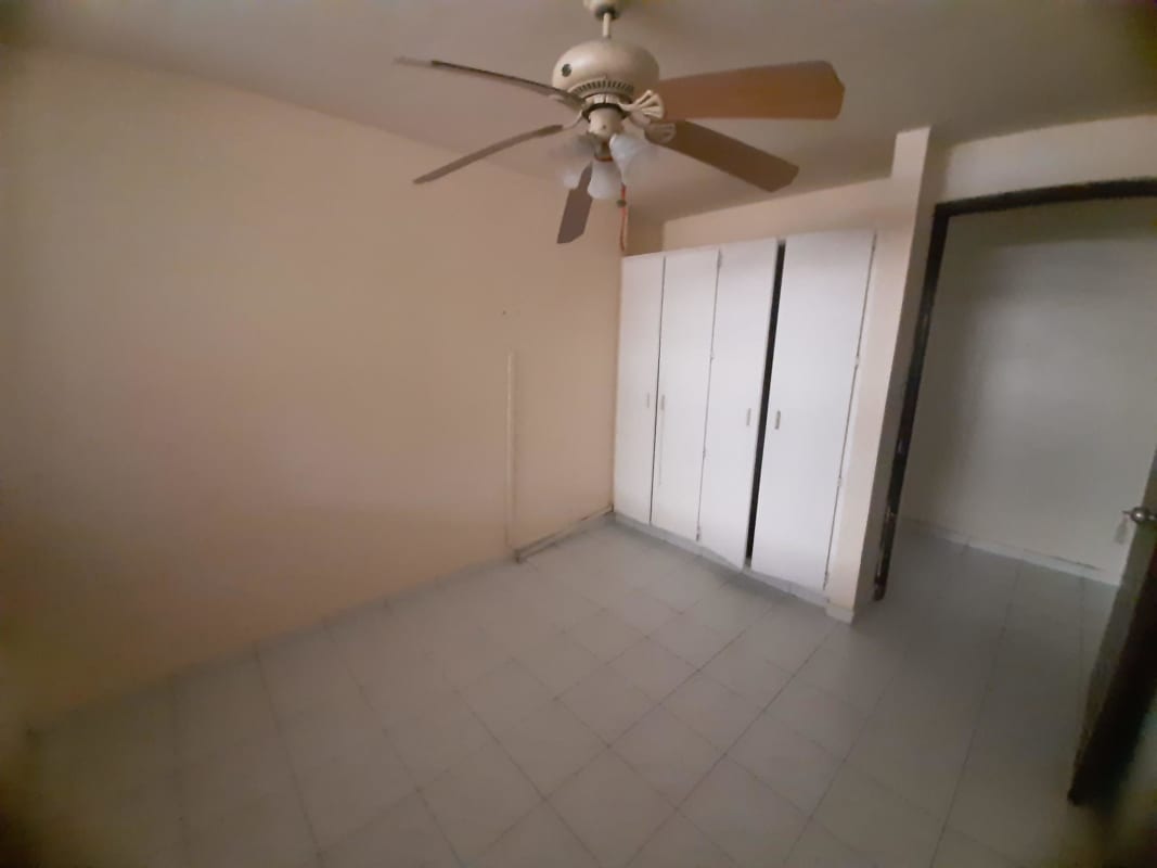 Living room with AC unit tile floor and white walls in PH Altos de Bella Vista Panama