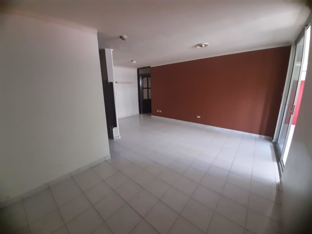 Interior courtyard with garden plants and security barred windows in PH Altos de Bella Vista Panama