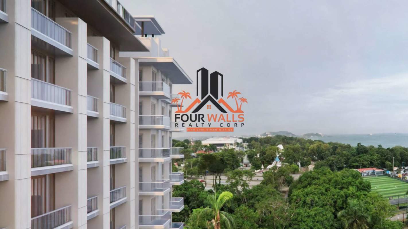 Open modern kitchen design and bright living area with terrace access at PH Nautilus