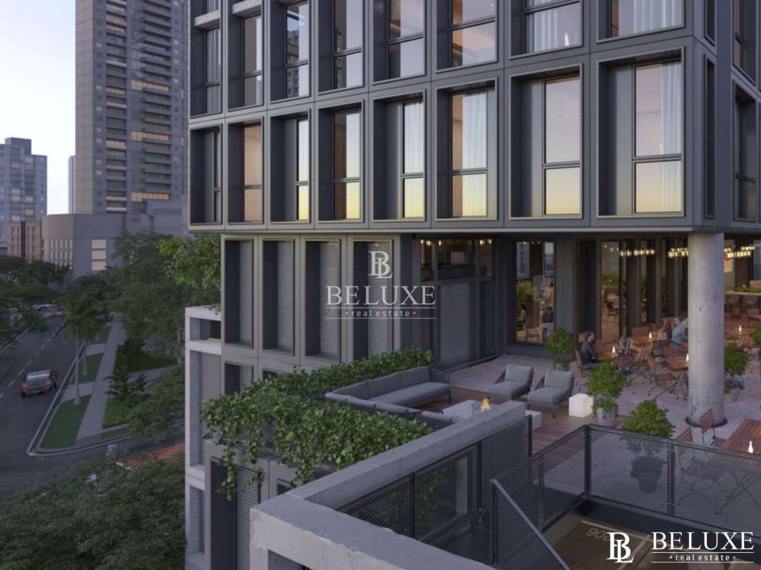 Open-air rooftop bar lounge terrace with ocean and city views at PH Tribu Panama