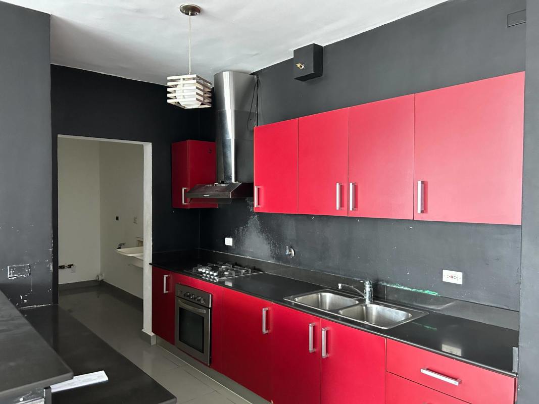 Rooftop indoor lounge area with windows city skyline PH Quartier San Francisco Panama