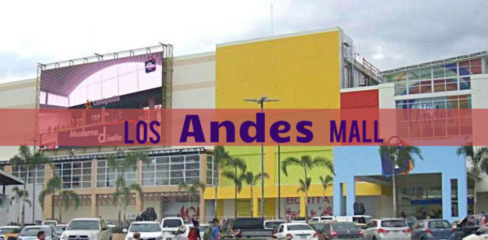 Exterior of Los Andes Mall with colorful facade and palm trees in Panama City