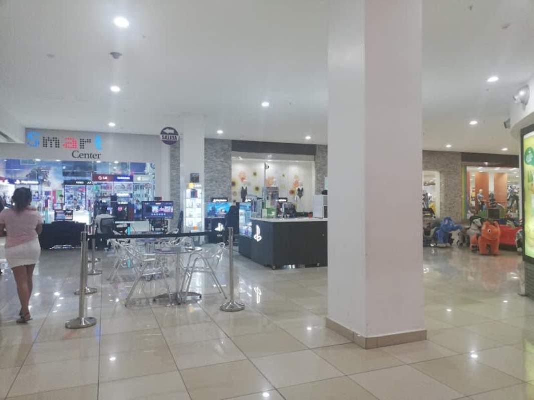 Mall interior showing multiple retail stores inside Los Andes Mall in Panama City