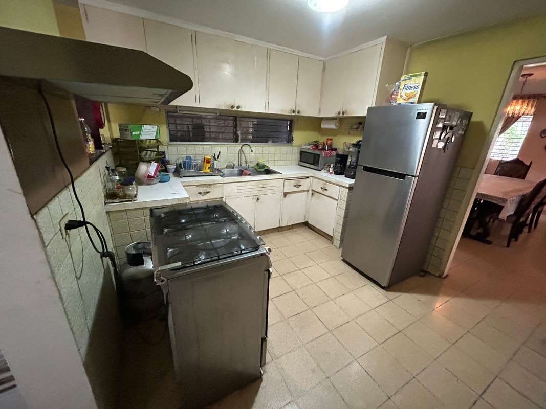 Kitchen with cream cabinets stove stainless appliances house Chanis Panama