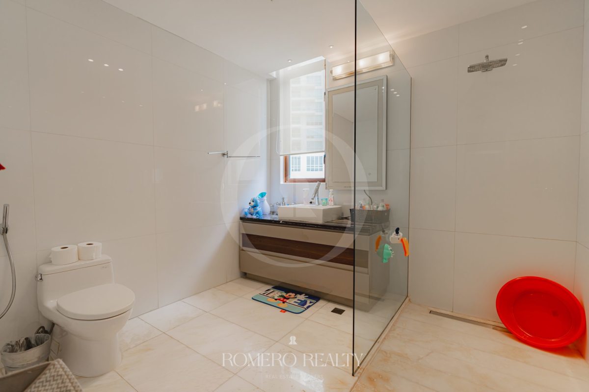 Spacious modern bedroom with ocean view window in Punta Pacifica Panama