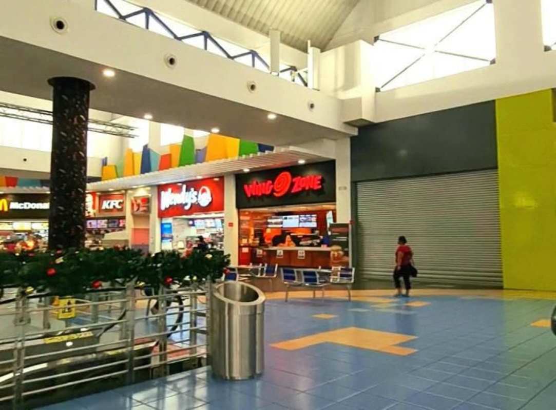 Mall food court at Albrook with franchises like McDonalds, KFC, Wendy's, Wing Zone