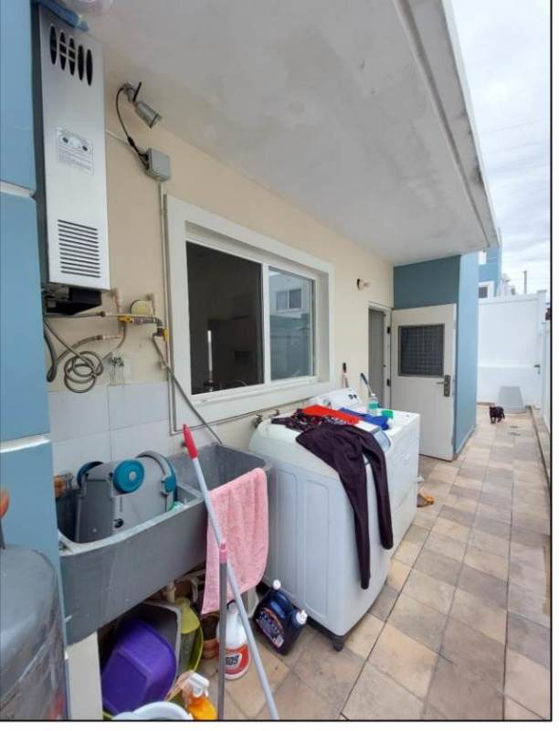 Outdoor laundry with washer hookup, sink, and window in Brisas del Golf Panama