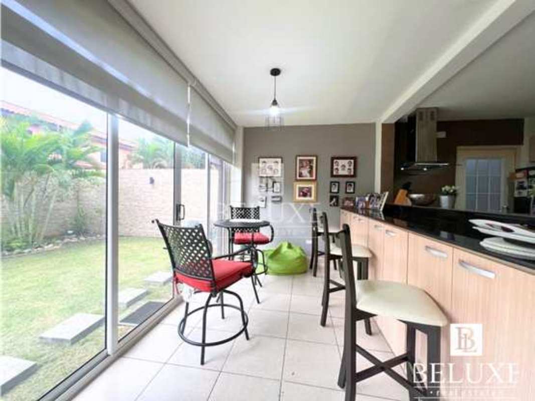 Entrance foyer and modern staircase inside house PH Versalles Panama