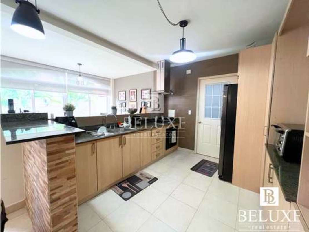 Dining room with natural light and modern design in remodeled house PH Versalles Panama City