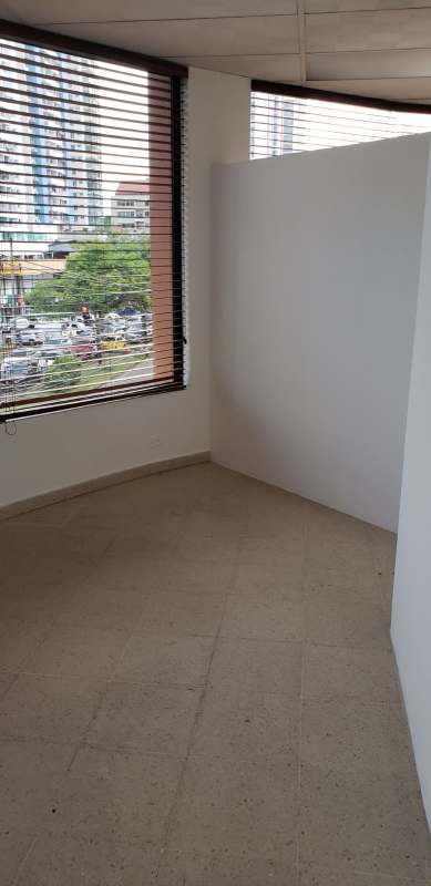 Office room with large windows blinds modern commercial space Panama City
