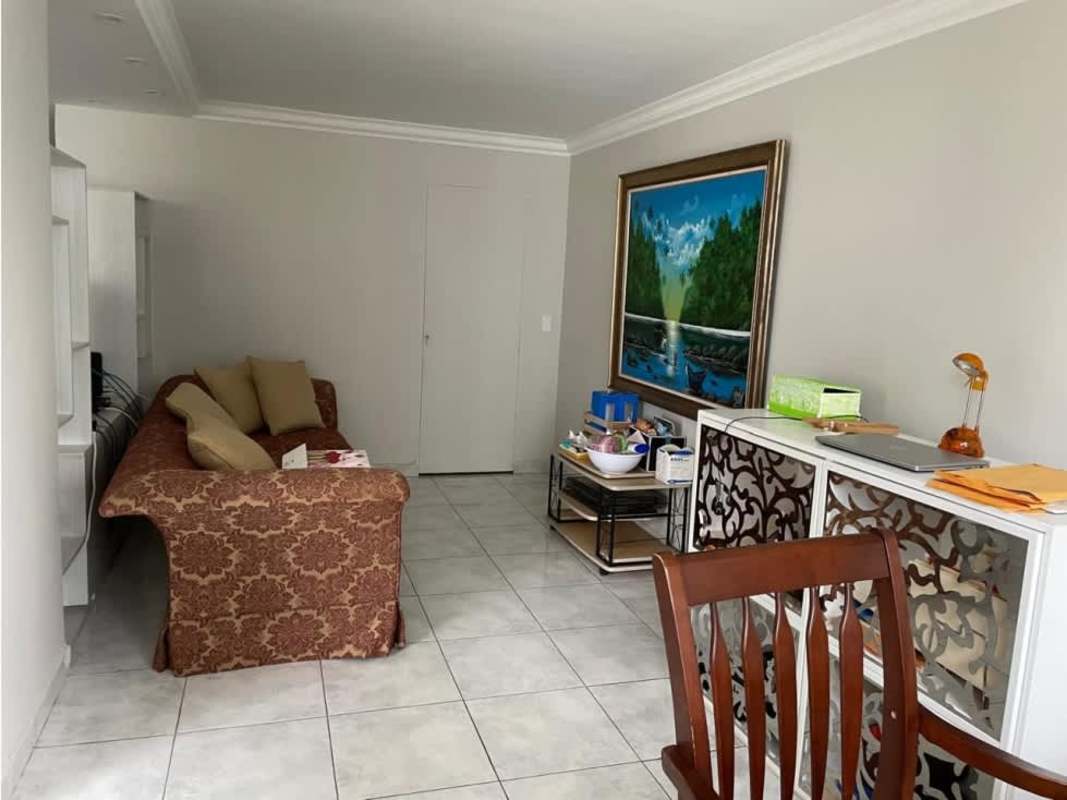 Bright living room with tiled floors, traditional upholstered sofa and artwork PH Fiesta Obarrio Panama