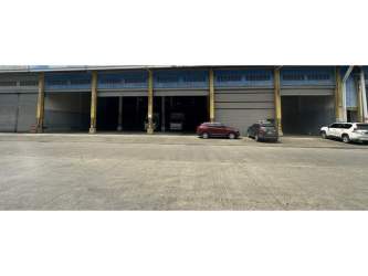 Warehouse interior showing tall shelving with forklift workspace at Free Zone Colón Panama