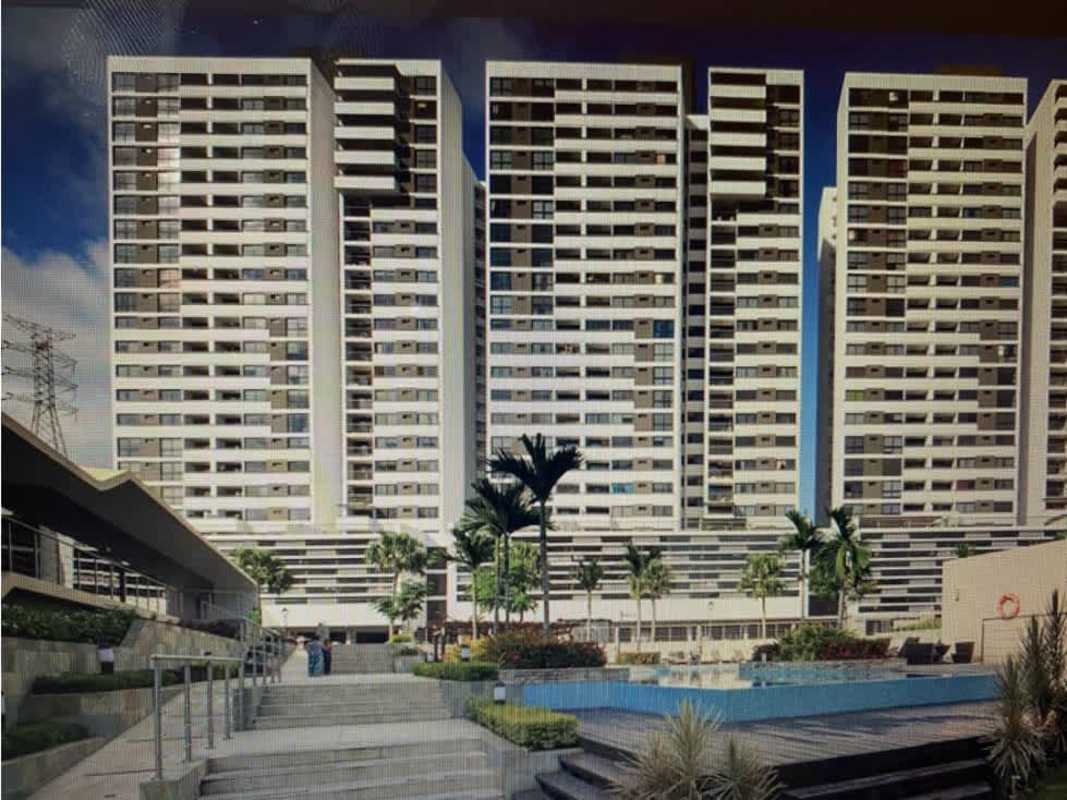 High-rise condominium towers surrounding pool at PH Country Club Condado del Rey