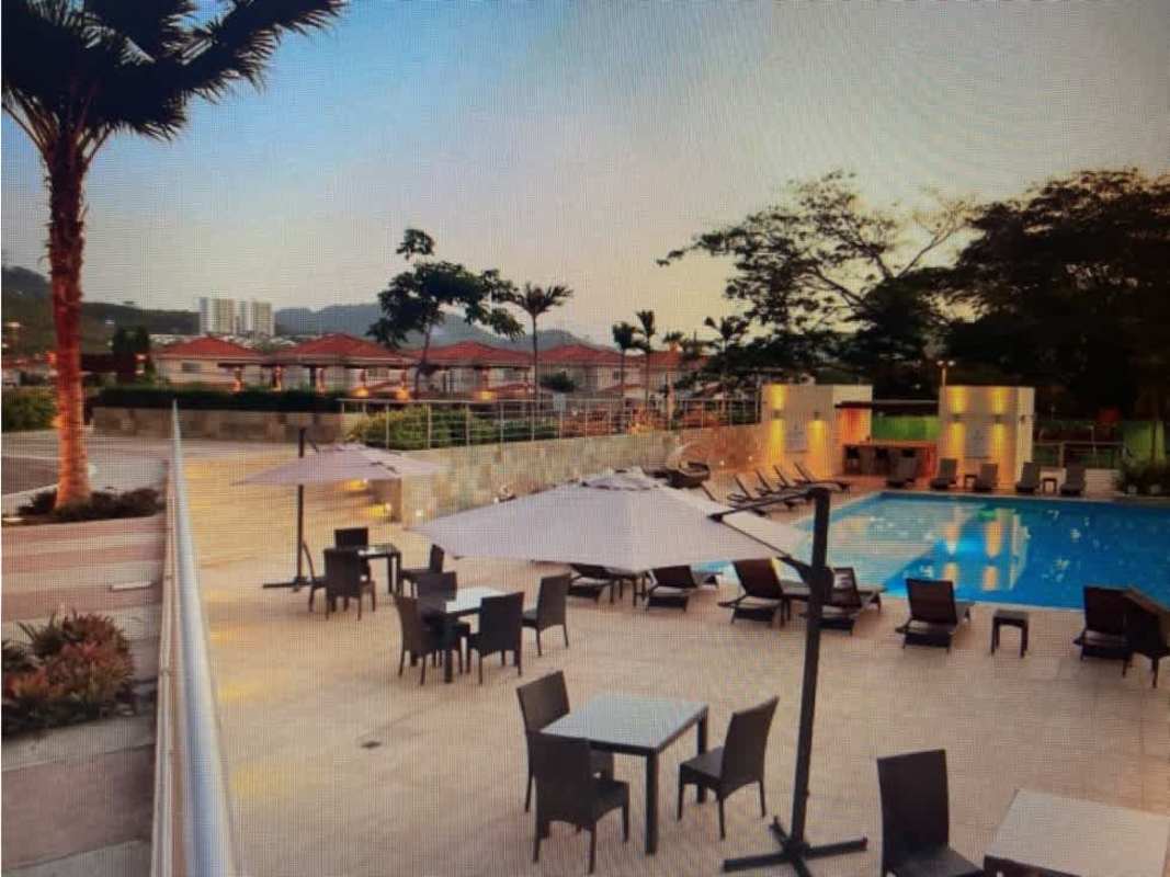 Aerial view residential complex with multiple swimming pools at PH Country Club Panama City