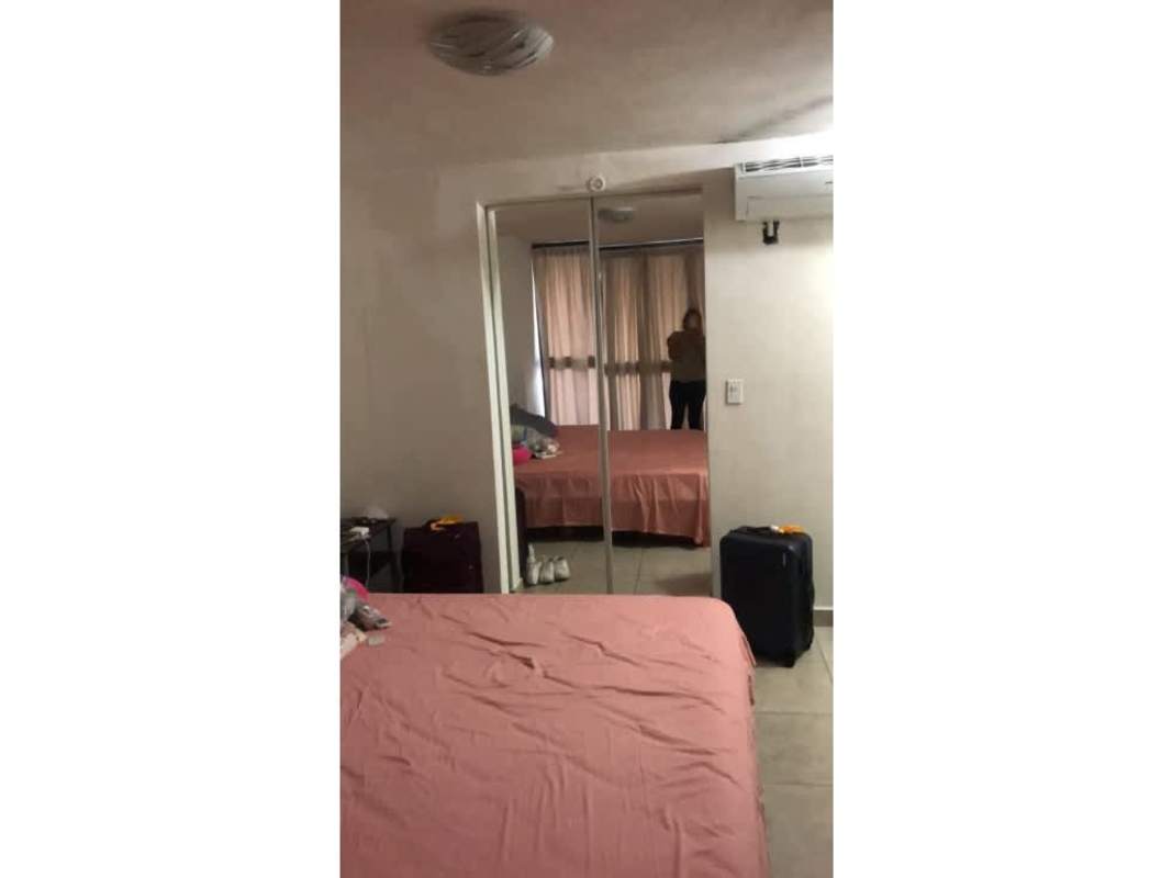 Poolside lounge chairs, umbrellas, and landscaping during sunset PH Country Club Condado del Rey Panama