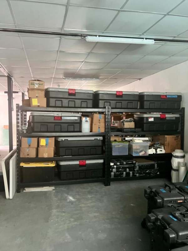 Large storage area galera with shelves and equipment cases in San Francisco commercial office building