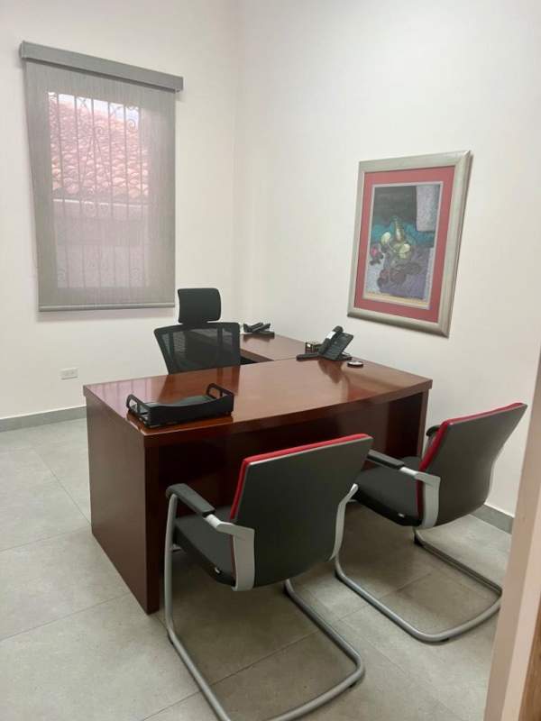 Interior hallway with tile flooring leading to private offices and restrooms in commercial space Panama