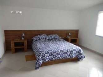 Covered terraces and gazebos with mountain views and outdoor seating at beach estate San Carlos Panama