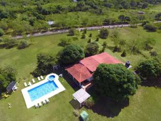 Collage of 7 bathrooms with tile walls, mirrors and accessories at beach estate San Carlos Panama