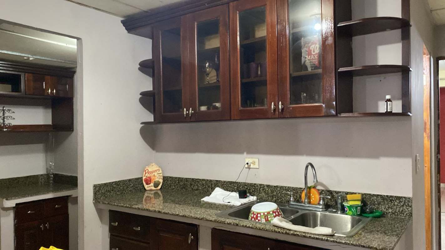 Granite counter kitchen with dark wood cabinets Buena Vista Tocumen Panama