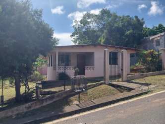 Traditional house with covered porch iron gate and yard La Chorrera Panama